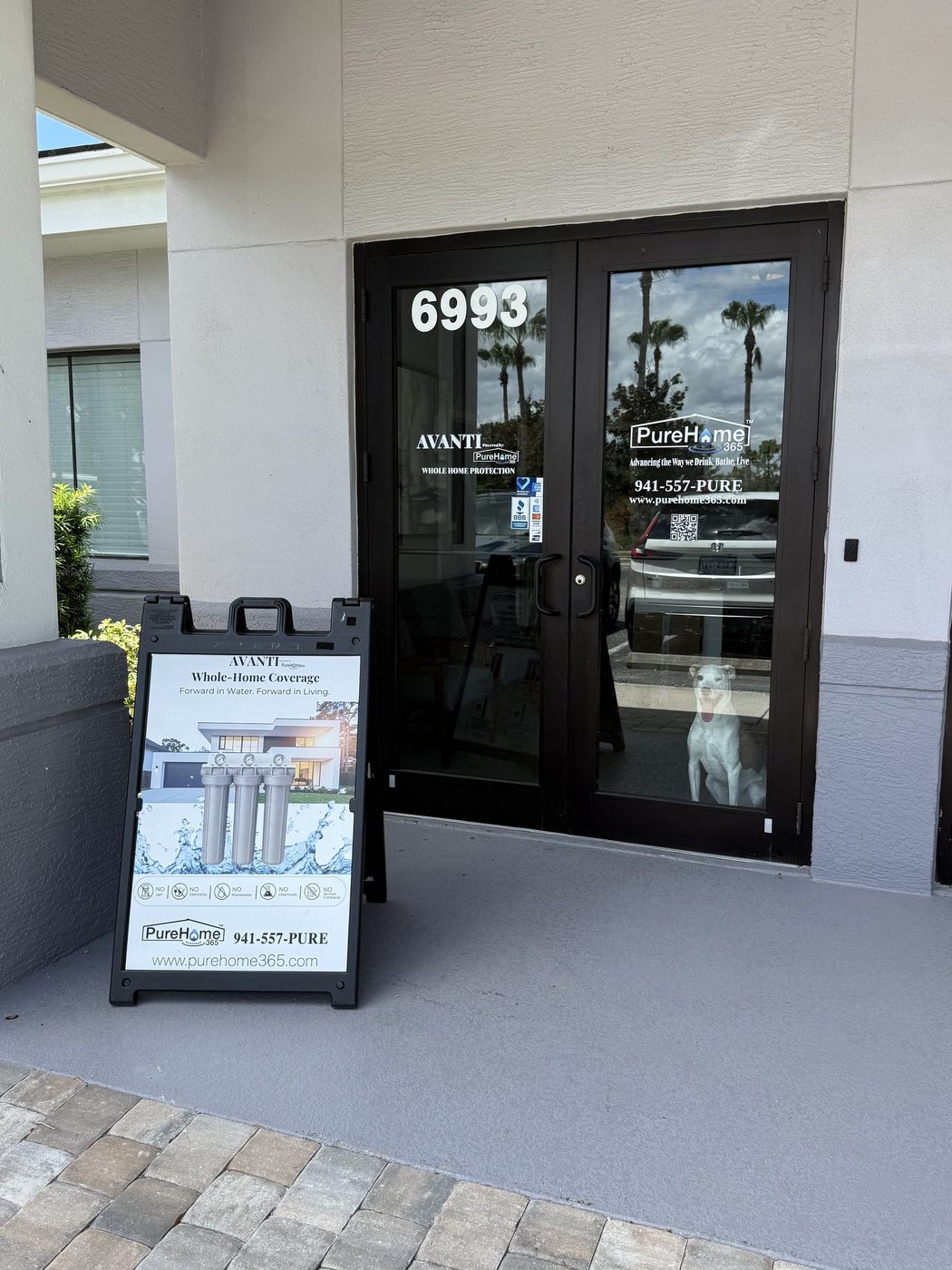 PureHome365 and AVANTI whole home protection signage on the entrance at unit 6993