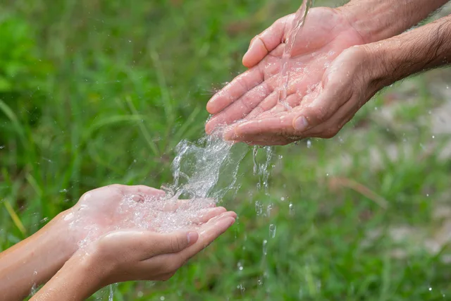 Clean water flowing over hands